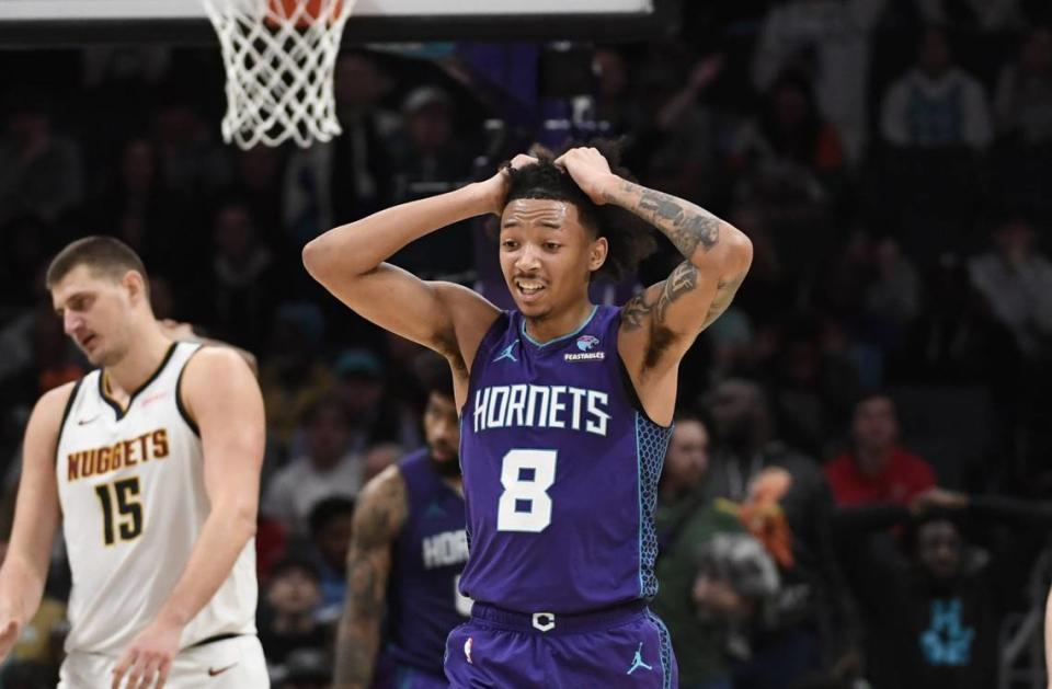 Charlotte Hornets guard Nick Smith Jr. (8) reacts after committing a foul on Denver Nuggets center Nikola Jokic (15) during the second half at the Spectrum Center.