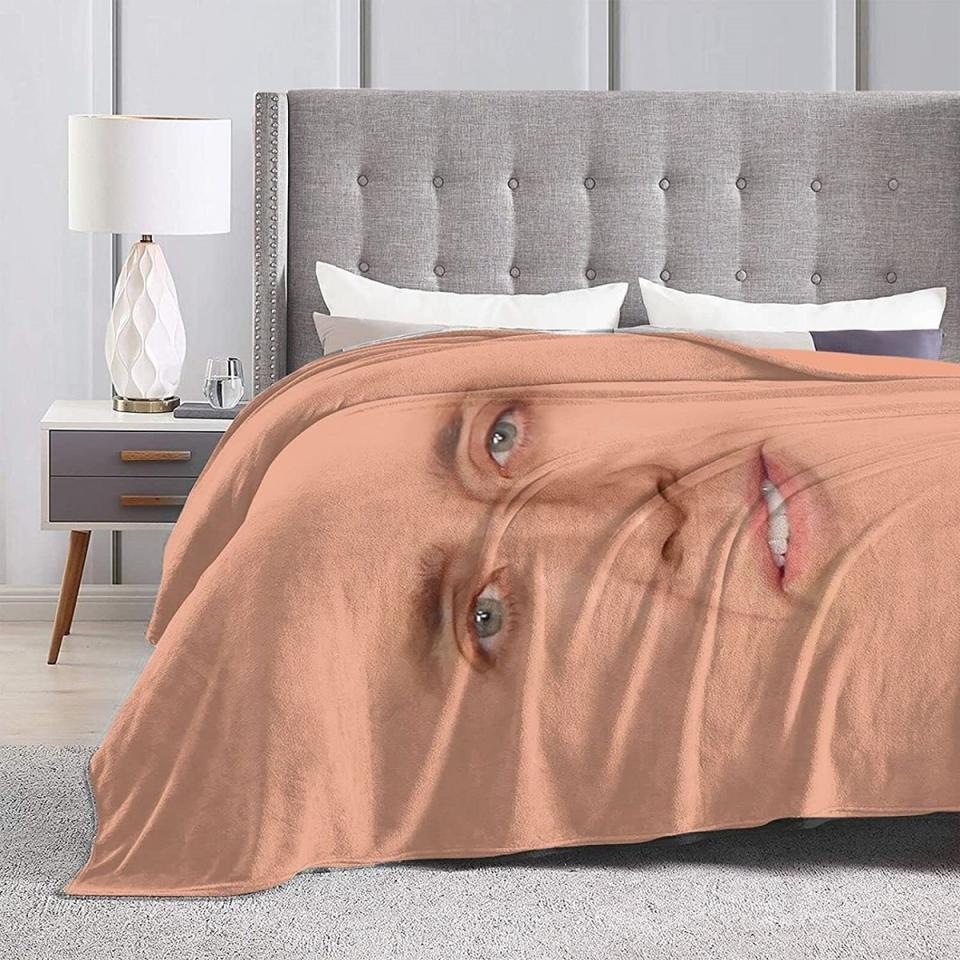 Nic Cage blanket on a bed