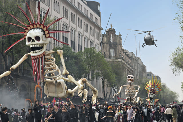 Bond chases Sciarra through the Day of the Dead parade in Mexico City. Scairraâ€™s helicopter swoops in to collect him in Metro-Goldwyn-Mayer Pictures/Columbia Pictures/EON Productionsâ€™ action adventure SPECTRE.