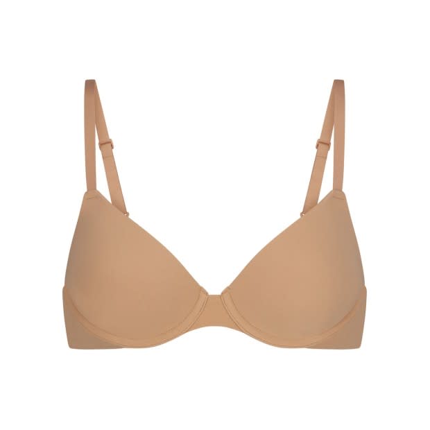 Skims Fits Everybody T-Shirt Bra in Ochre, $52, <a href="https://rstyle.me/+ViniTiteEDuU8sGF6rQIjA" rel="nofollow noopener" target="_blank" data-ylk="slk:available here;elm:context_link;itc:0;sec:content-canvas" class="link ">available here</a>