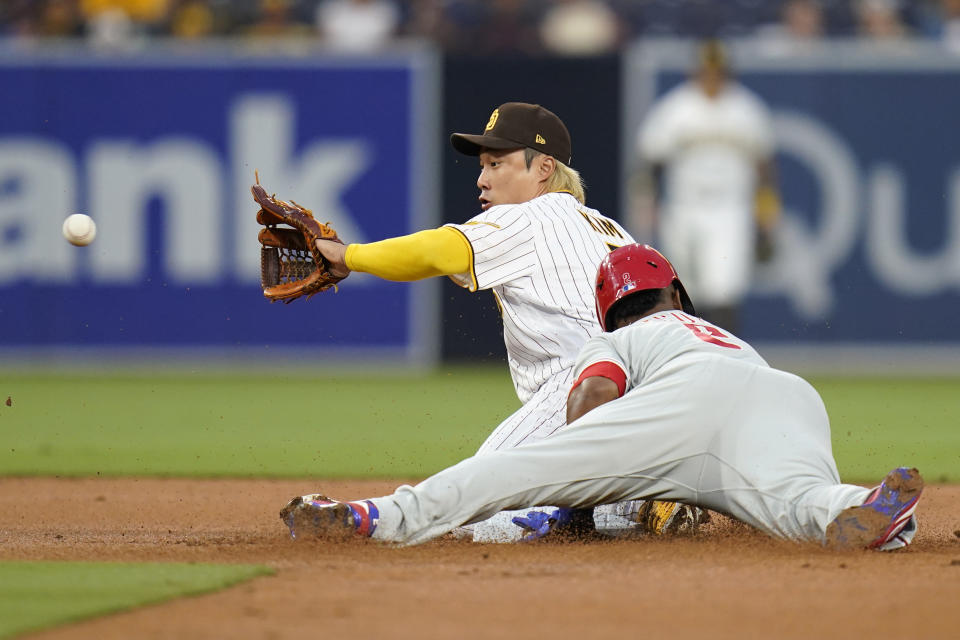 Philadelphia Phillies' Jean Segura, bottom, safely steals second base as San Diego Padres second baseman Ha-Seong Kim, top, awaits for the throw during the first inning of a baseball game Friday, Aug. 20, 2021, in San Diego. (AP Photo/Gregory Bull)