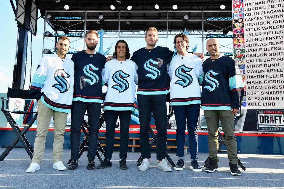 SEATTLE, WASHINGTON - JULY 21: The Seattle Kracken draft picks (L-R) Jordan Eberle, Chris Driedger, Chris Tanev, Jamie Oleksiak, Haydn Fleury and Mark Giordano following the 2021 NHL Expansion Draft at Gas Works Park on July 21, 2021 in Seattle, Washington. The Seattle Kraken is the National Hockey League's newest franchise and will begin play in October 2021. (Photo by Alika Jenner/Getty Images)