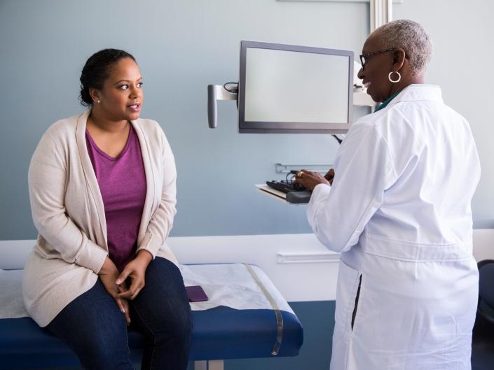 stock image of doctor and patient in doctor's office