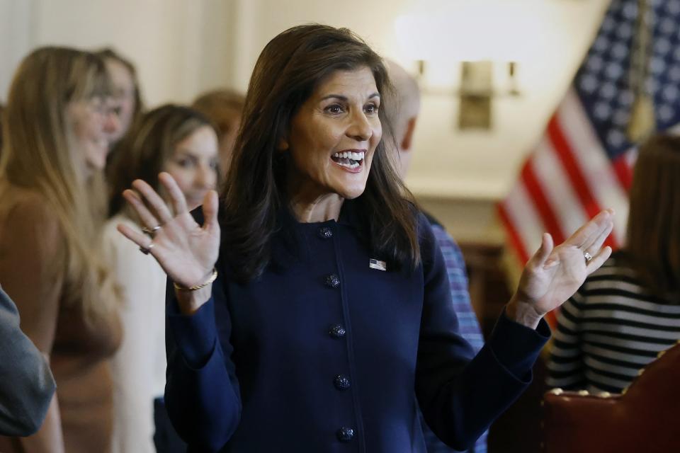 Former U.N. Ambassador Nikki Haley greets supporters after signing papers to get on the Republican presidential primary ballot at the New Hampshire Statehouse, Friday, Oct. 13, 2023, in Concord, N.H. (AP Photo/Michael Dwyer)