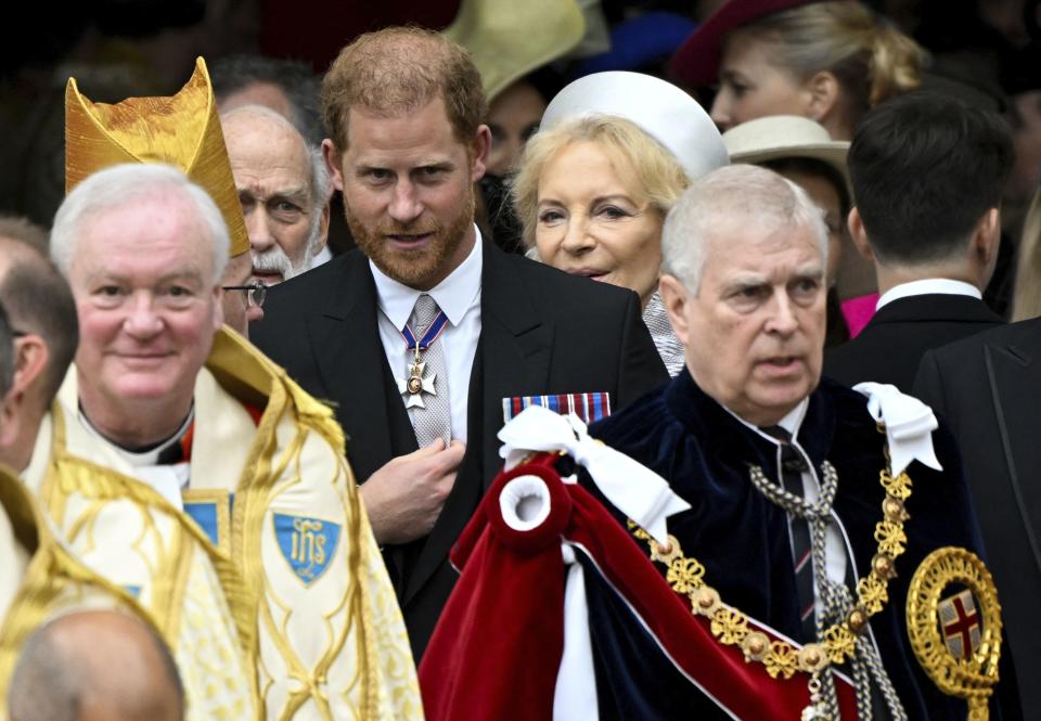 Britain’s Prince Harry and Prince Andrew leave Westminster Abbey following the coronation ceremony of Britain’s King Charles and Queen Camilla, in London.