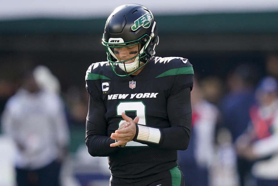 New York Jets quarterback Zach Wilson (2) reacts after throwing an interception against the New England Patriots during the third quarter of an NFL football game, Sunday, Oct. 30, 2022, in New York. (AP Photo/John Minchillo)