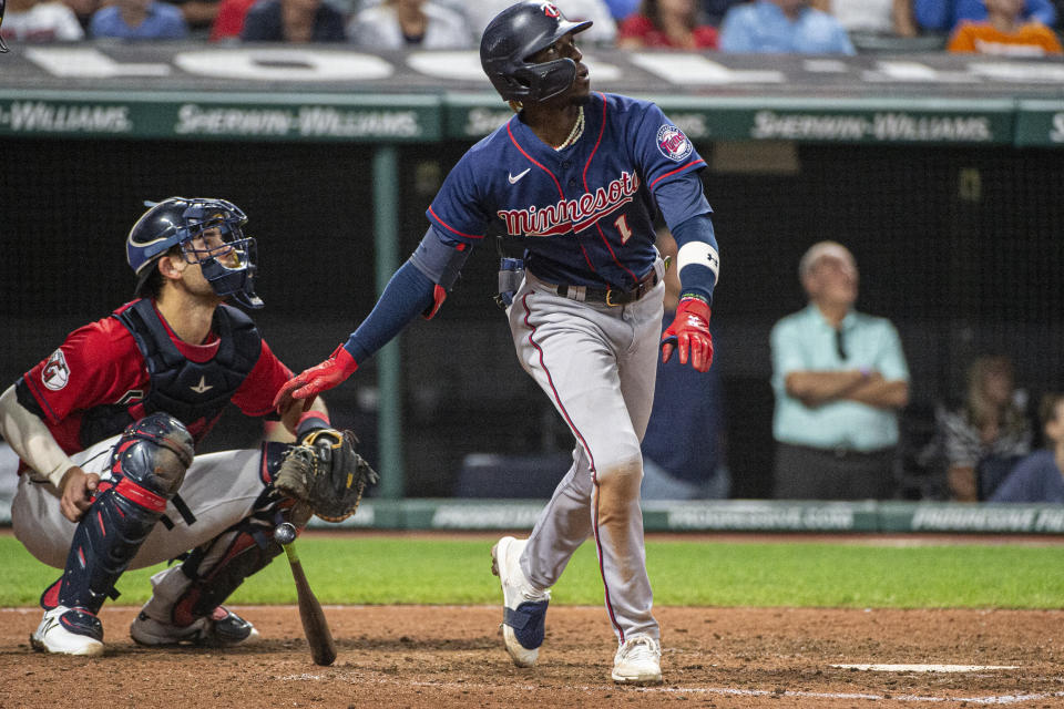 Minnesota Twins' Nick Gordon, right, and Cleveland Guardians' Luke Maile watch Gordon's two-run home run off Guardians relief pitcher James Karinchak during the eighth inning of the second game of a baseball doubleheader in Cleveland, Saturday, Sept. 17, 2022. (AP Photo/Phil Long)