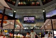 A news conference of Hong Kong's Chief Executive Carrie Lam is televised in a shopping mall in Hong Kong