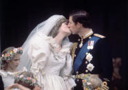 <p>Over 100 million people worldwide tuned in for the fairytale wedding of Charles, Prince of Wales, and Lady Diana Spencer on July 29, 1981. After the ceremony, the couple delighted onlookers by sharing a spontaneous smooch. <i>[Photo: Rex/Reginald Davis]</i><br></p>