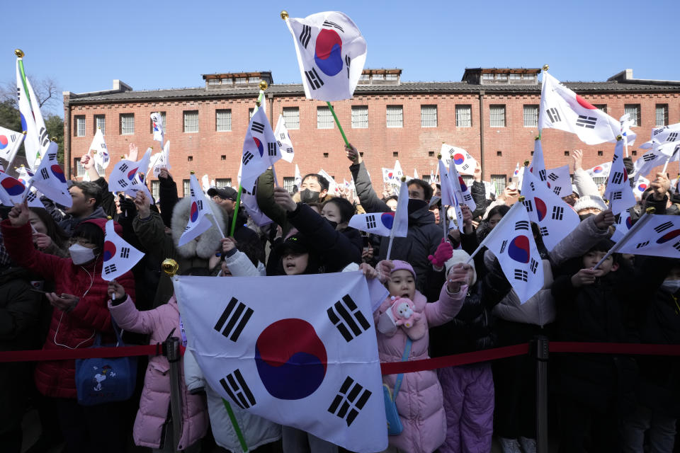 South Koreans cheer for the country during a ceremony to celebrate the March First Independence Movement Day, the anniversary of the 1919 uprising against Japanese colonial rule, in Seoul, South Korea, Friday, March 1, 2024. (AP Photo/Ahn Young-joon)