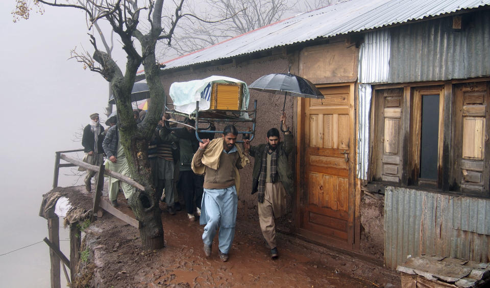 Villagers carry casket of a boy, who was killed by Indian shelling, for funeral prayer at a village in Hatian Bala, 40 kilometers from Muzafarabad, capital of Pakistani Kashmir, Saturday, March 2, 2019. Indian and Pakistani soldiers again targeted each other's posts and villages along their volatile frontier in disputed Kashmir, killing at some civilians and wounding few others, officials said. (AP Photo/M.D. Mughal)