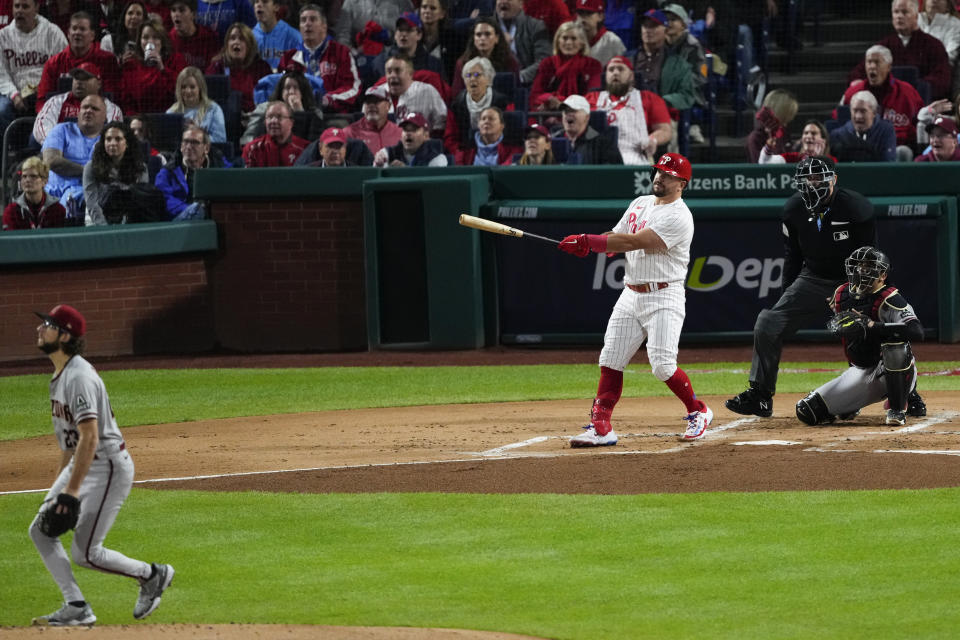 Philadelphia Phillies' Kyle Schwarber watches his home un off Arizona Diamondbacks starting pitcher Zac Gallen during the first inning in Game 1 of the baseball NL Championship Series in Philadelphia, Monday, Oct. 16, 2023. (AP Photo/Matt Rourke)