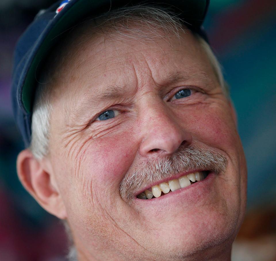 Larry Creed, 63, who has a bright smile and a soft voice, isn't the stereotypical carnival barker. He's working a water game on the midway at the Marshfield Fair. Monday, Aug. 21, 2023.