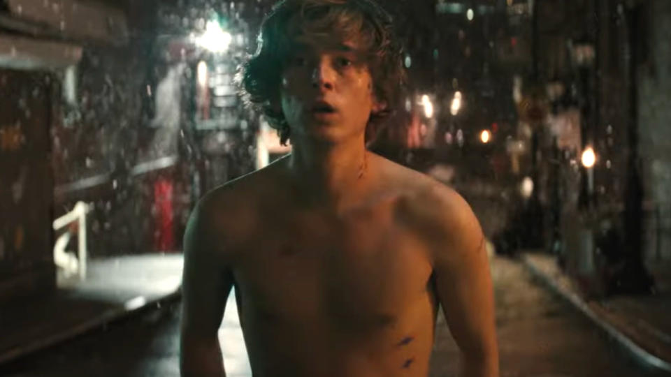 Austin Abrams stands stunned and shirtless on a snowy night in Wolfs.