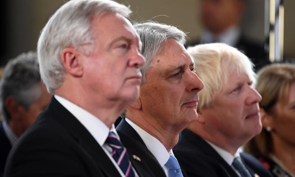 David Davis, Philip Hammond and Boris Johnson (left to right) listen to May give her Brexit speech in Florence on Friday.