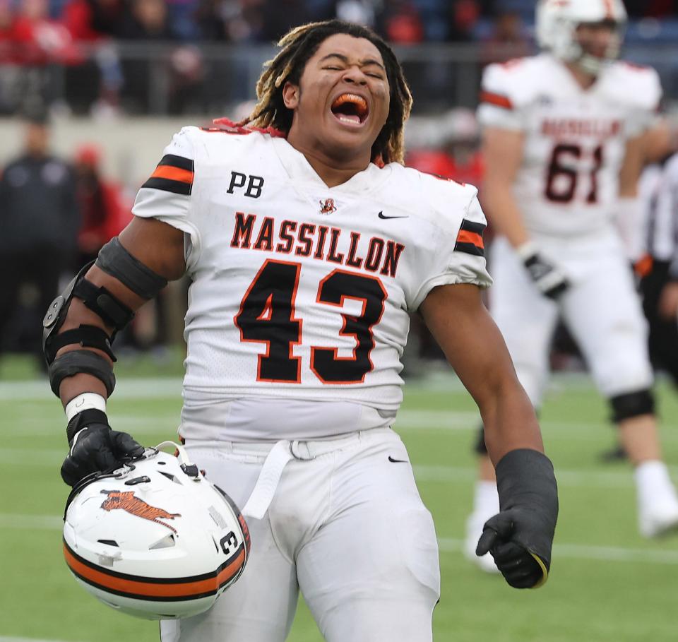 Massillon's Malachi Card celebrates at the end of the Massillon / McKinley game at Tom Benson Hall of Fame Stadium Saturday , October 21, 2023.