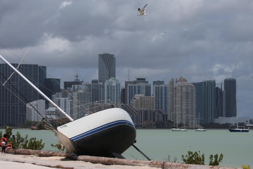 The Miami skyline is seen above a boat that went ashore after the passing of Hurricane Irma. (Photo: Carlo Allegri / Reuters)