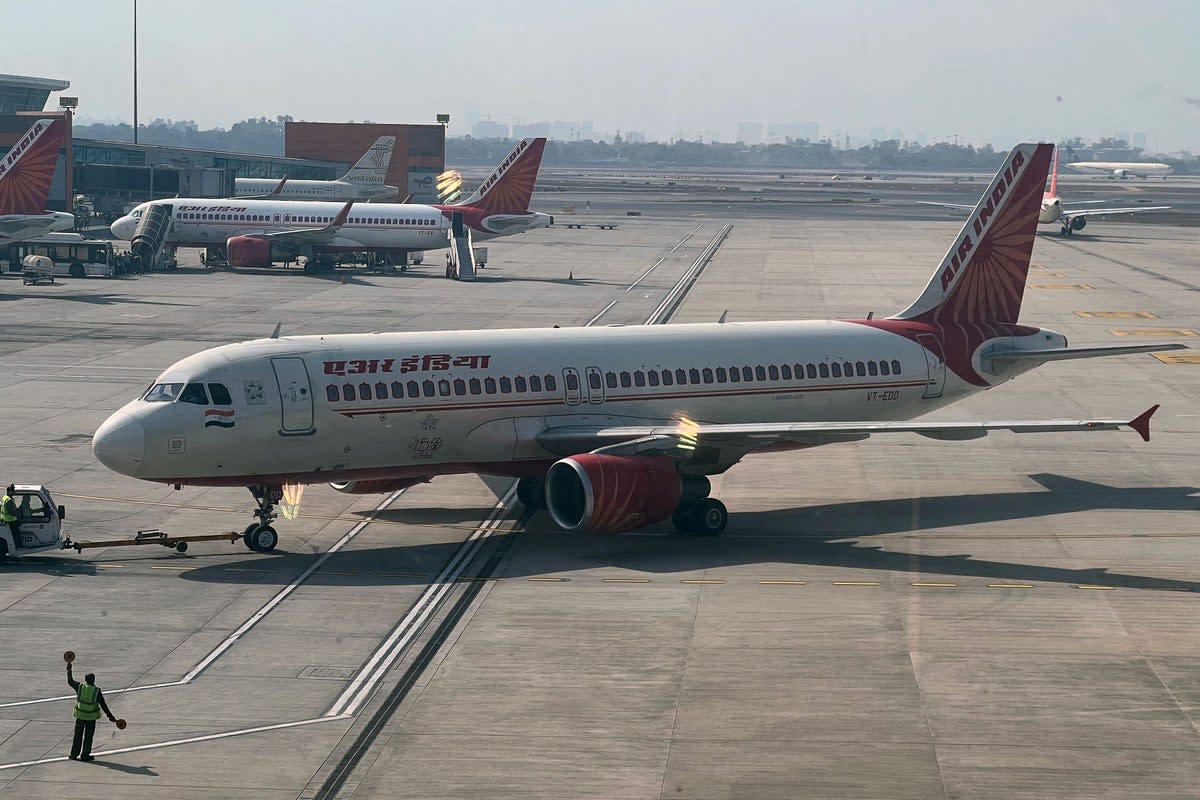 An Air India aircraft on the tarmac at the Indira Gandhi international airport in New Delhi on 20 January (AFP via Getty)