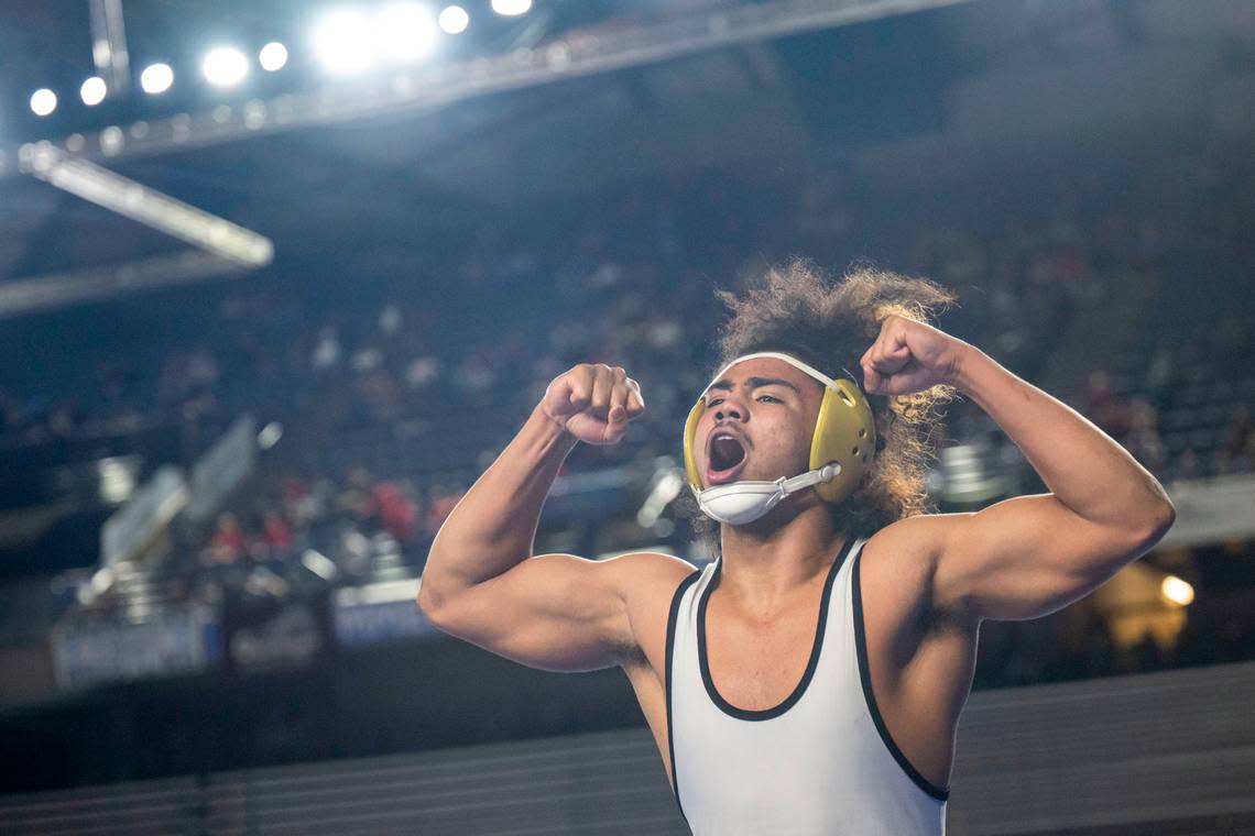 Lincoln’s Navarre Dixon celebrates after pinning Hermiston’s Jaxson Gribskov in the 182-pound, Class 3A championship match at Mat Classic XXXIV on Saturday, Feb. 18, 2023, at the Tacoma Dome in Tacoma, Wash. Dixon pinned Gribskov in 1 minute, 27 seconds.