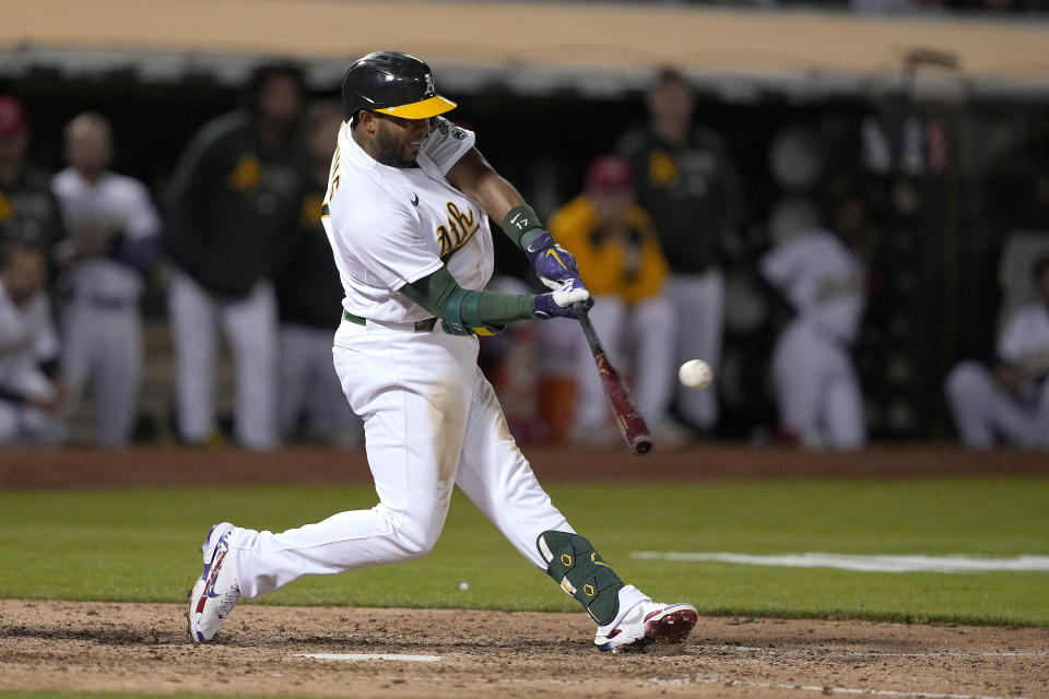 Oakland Athletics' Elvis Andrus hits a solo home run against the Boston Red Sox during the ninth inning of a baseball game Friday, July 2, 2021, in Oakland, Calif. (AP Photo/Tony Avelar)