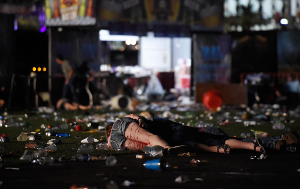 <p>A person lies on the ground covered with blood at the Route 91 Harvest country music festival after apparent gun fire was heard on Oct. 1, 2017 in Las Vegas, Nevada. There are reports of an active shooter around the Mandalay Bay Resort and Casino. (Photo: David Becker/Getty Images) </p>