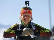 Biathlon - IBU World Championships - Women 12.5 km Mass Start - Hochfilzen, Austria - 19/2/17 - Laura Dahlmeier of Germany displays her medals. REUTERS/Leonhard Foeger