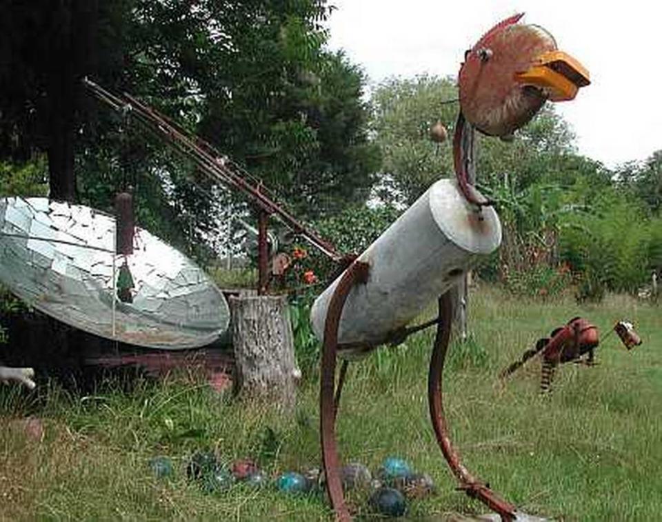 This chicken-shaped “rustasaurus,” one of the metal sculptures John Wilkerson crafts out of scrap metal and discarded farm equipment parts, stands guard over the Glendale Memorial Nature Preserve.