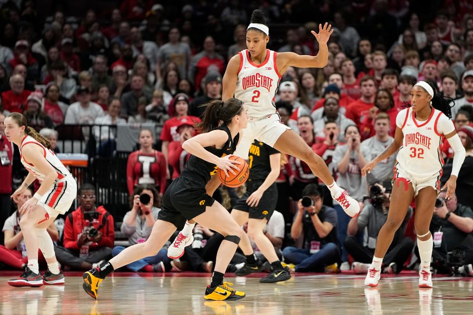 Ohio State forward Taylor Thierry (2) defends Iowa's Caitlin Clark during the second half of OSU's 83-72 loss at Value City Arena.