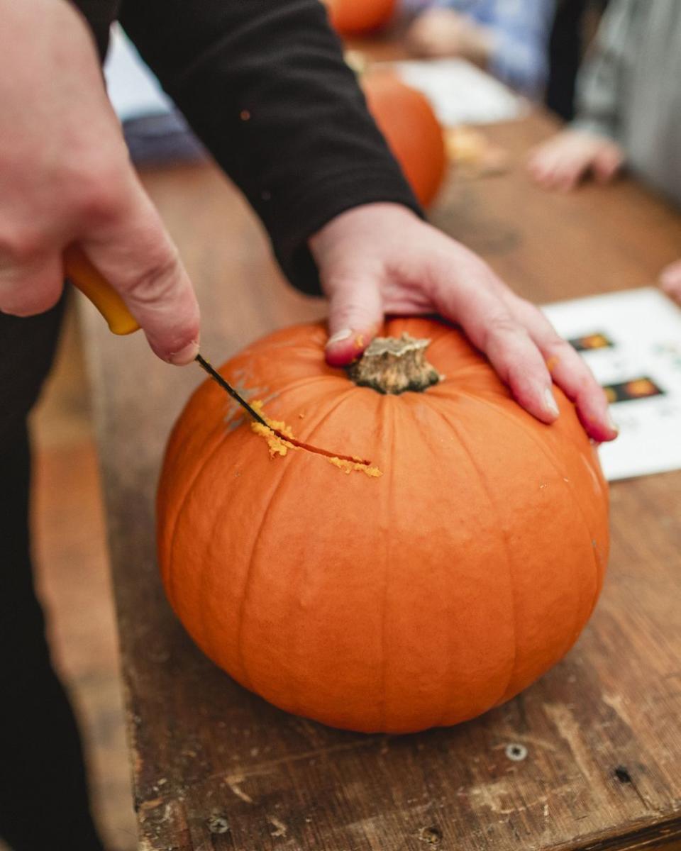 2) Carve pumpkins.