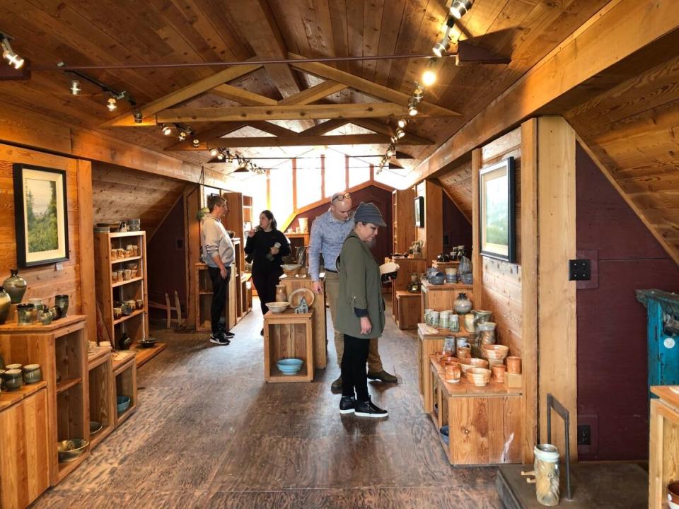 Community members shop for ceramics at the Herman Venema Pottery Studio, which closed last weekend after almost 50 years.  (Submitted by Gillian McMillan - image credit)