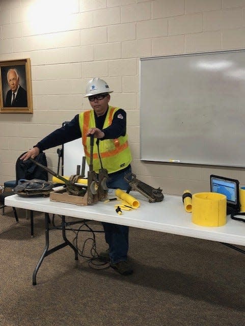 Dominion representative Danny Revels demonstrates a pipe fusion for Grier Middle School students on March 6, 2024.