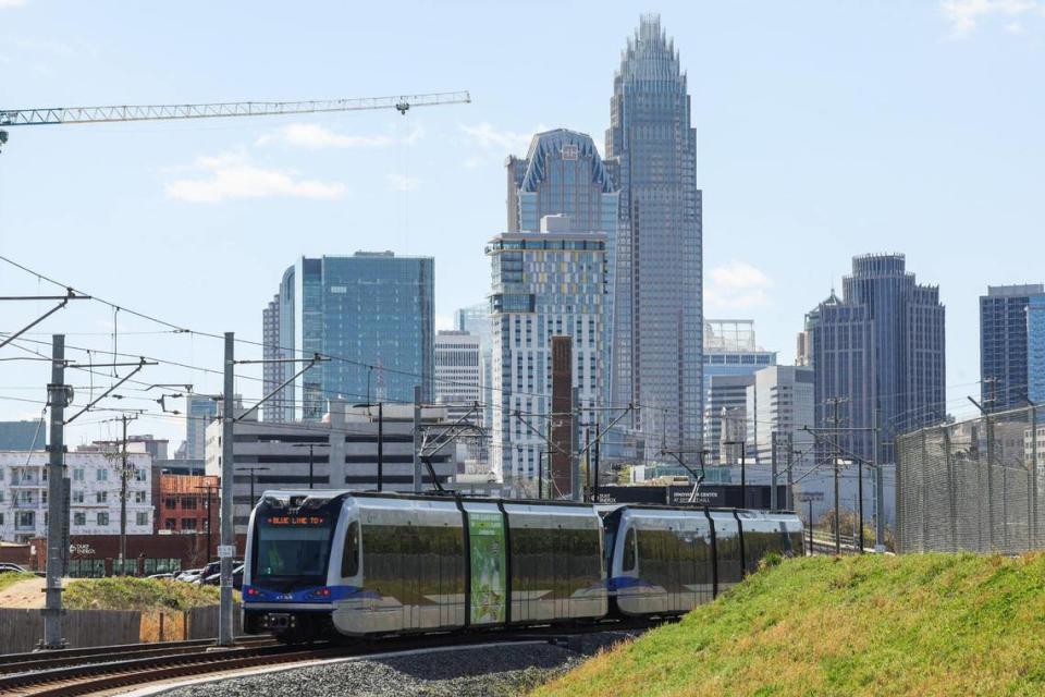 Charlotte’s Blue Line rolls past a station with the uptown skyline in the background. Melissa Melvin-Rodriguez/mrodriguez@charlotteobserver.com