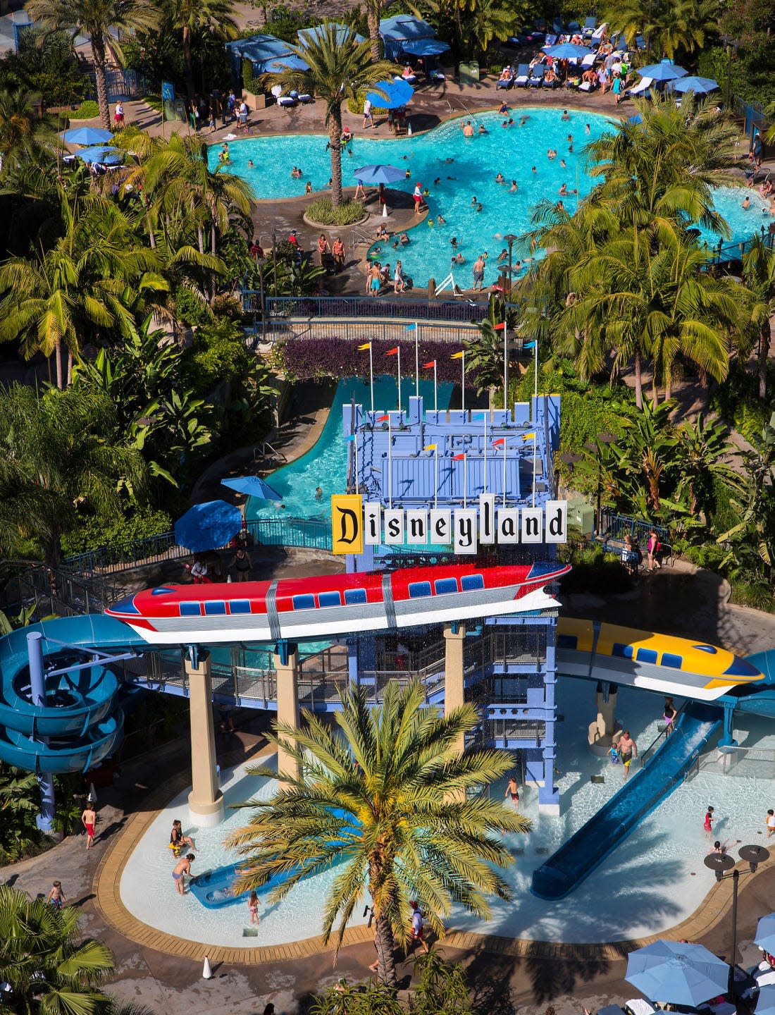 monorail slides at the disneyland hotel at the disneyland hotel, the centerpiece of the pool area calls to mind past disneyland park iconography classic disneyland block signage combines with replica monorail trains to create an experience that is both fun and nostalgic paul hiffmeyerdisneyland