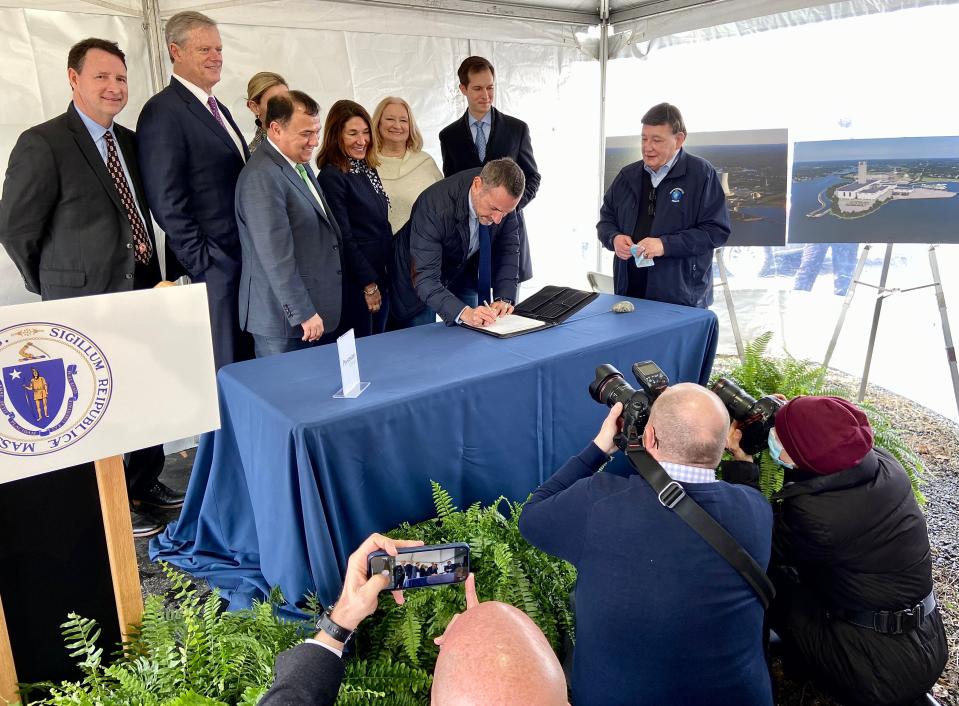 Hakan Ozmen of Prysmian Group, the Italian company that will manufacture submarine cables at Brayton Point for off-shore wind projects, signs a contract to buy 47 acres in the company of Gov. Charlie Baker, Lt. Governor Karyn Polito and other elected officials.