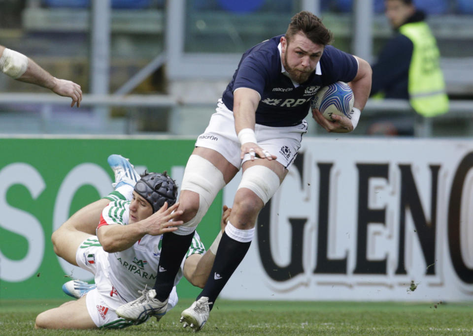 Scotland's Ryan Wilson, right, is tackled by Italy's Michele Campagnaro during a Six Nations rugby union international match between Italy and Scotland, in Rome, Saturday, Feb. 22, 2014. (AP Photo/Andrew Medichini)