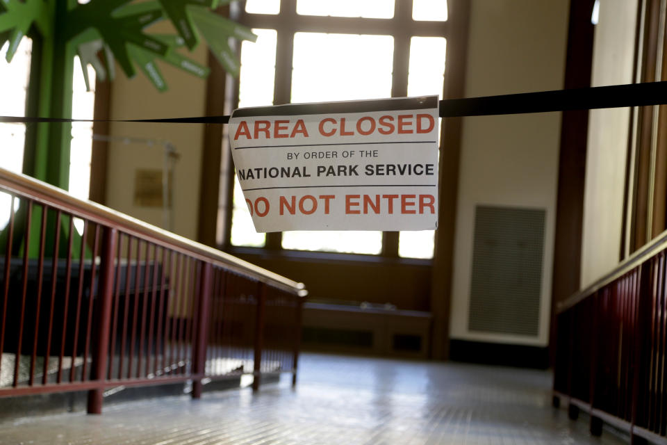 A sign lets visitors know that a portion of the exhibit space at Ellis Island is closed in New York, Monday, Oct. 28, 2013. The island that ushered millions of immigrants into the United States received visitors Monday for the first time since Superstorm Sandy. Sandy swamped boilers and electrical systems and left the 27.5-acre island without power for months. (AP Photo/Seth Wenig)