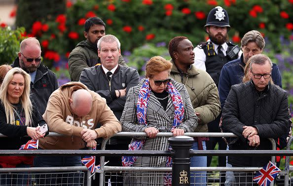 LONDON, ENGLAND - SEPTEMBER 19: Mourners at Westminster Abbey for the State Funeral of Queen Elizabeth II on September 19, 2022 in London, England. Elizabeth Alexandra Mary Windsor was born in Bruton Street, Mayfair, London on 21 April 1926. She married Prince Philip in 1947 and ascended the throne of the United Kingdom and Commonwealth on 6 February 1952 after the death of her Father, King George VI. Queen Elizabeth II died at Balmoral Castle in Scotland on September 8, 2022, and is succeeded by her eldest son, King Charles III.  (Photo by Dan Kitwood/Getty Images)