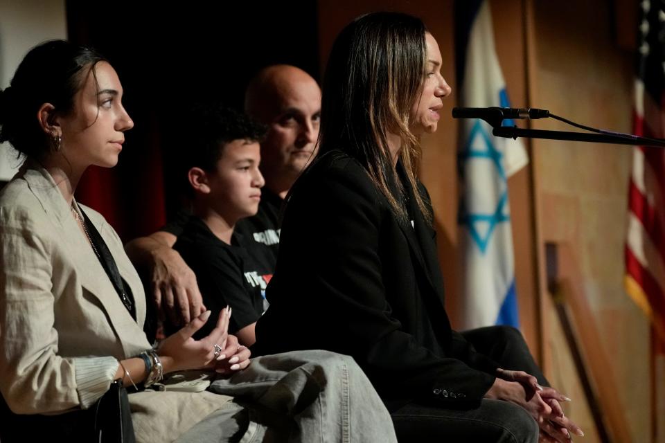 Yael Alexander addresses people at the Jewish Community Center, in Tenafly. An estimated 400 people attended a rally for her son, Edan Alexander and the other estimated 200 people who were kidnapped on October 7. Watching Alexander speak is her daughter, Mika, her younger son, Roi, and husband, Adi. Edan is a graduate of Tenafly High School. Wednesday, November 8, 2023