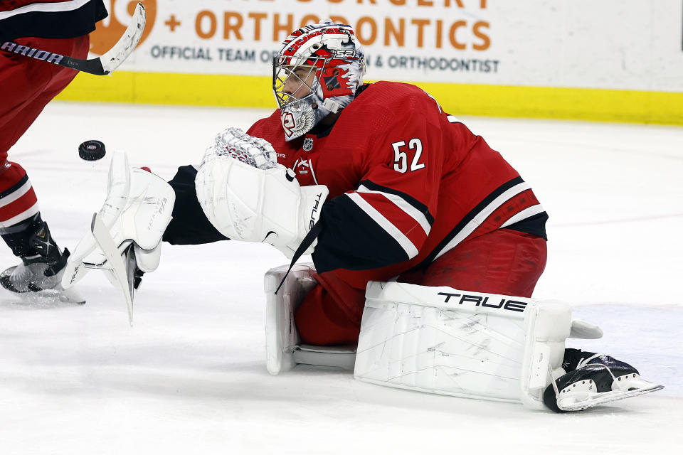 Carolina Hurricanes goaltender Pyotr Kochetkov (52) blocks a shot by the Dallas Stars during the first period of an NHL hockey game in Raleigh, N.C., Saturday, Feb. 24, 2024. (AP Photo/Karl B DeBlaker)