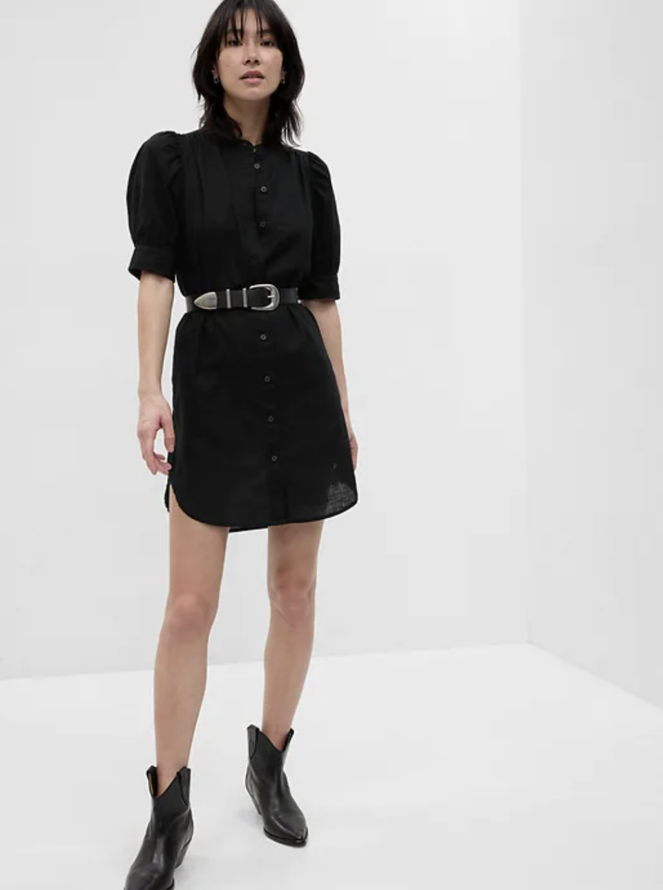 model wearing black cowboy boots and belted black Puff Sleeve Linen-Cotton Shirtdress (photo via Gap)