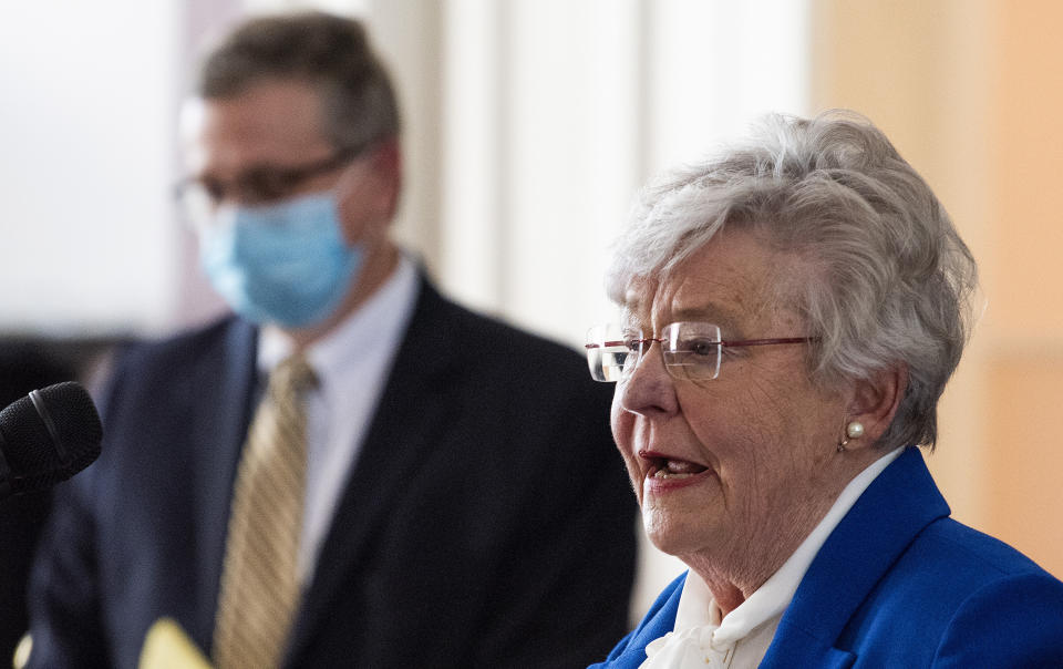 FILE - Alabama Gov. Kay Ivey announces continued social distancing during her coronavirus update Tuesday, April 28, 2020 at the state capitol building in Montgomery, Ala. Some governors across the U.S., especially in Republican-leaning states, have been stressing the need for “personal responsibility” to combat the coronavirus instead of issuing statewide mandates to wear masks or avoid large social gatherings. “You shouldn’t have to order somebody to do what is just in your own best interest and that of your family, friends and neighbors,” Alabama Gov. Kay Ivey, a Republican, said earlier this week as she urged people to wear masks and take other precautions but downplayed the effectiveness of statewide orders to do so. (Mickey Welsh/The Montgomery Advertiser via AP, file)