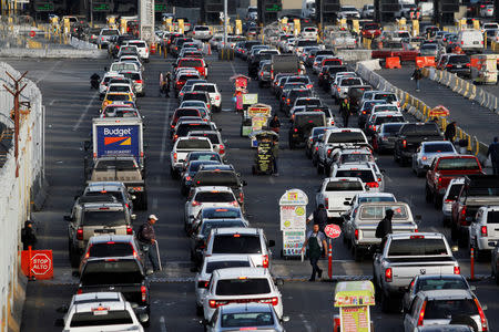 Cars queue up in multiple lines as they wait to be inspected by U.S. border patrol officers to enter from Mexico into the U.S., at the San Ysidro point of entry, in Tijuana, Mexico April 1, 2019. REUTERS/Jorge Duenes