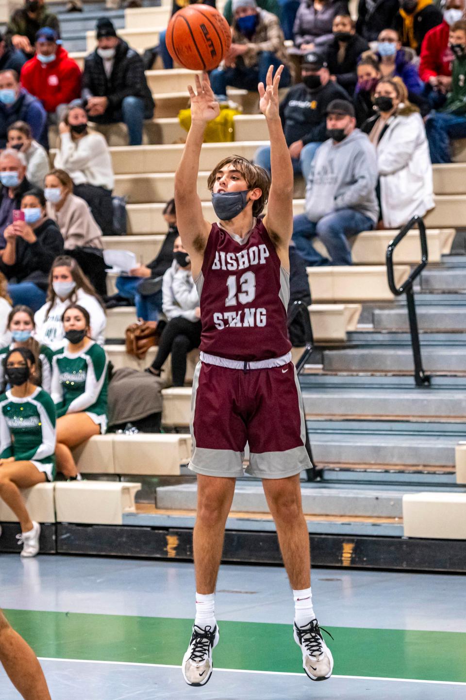 Bishop Stang's Frank Vollaro gets a good look at the baseline three pointer.