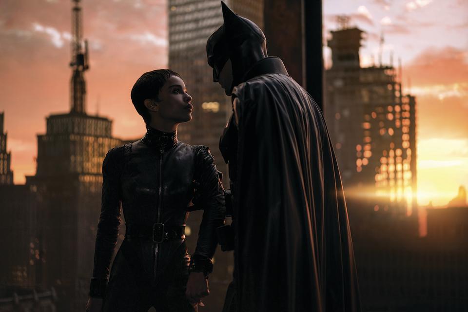 Virtual cinematography; catwoman and batman on a roof at sunset