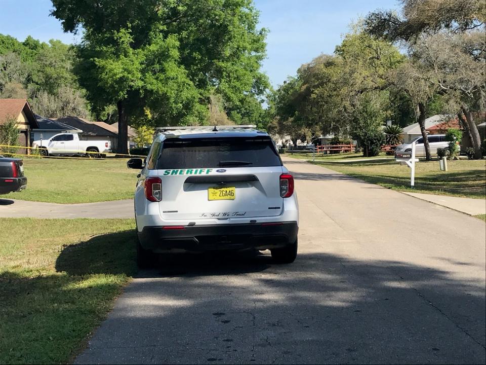 A Marion County Sheriff's Office vehicle sits in front of Alice Trench's residence in late March 2021. Trench's body was found inside her home and her grandson was charged with her death.