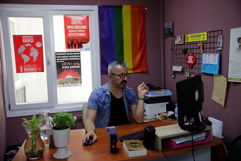 LGBT rights activist Cuneyt Yilmaz works at an office before an interview with Reuters in Istanbul