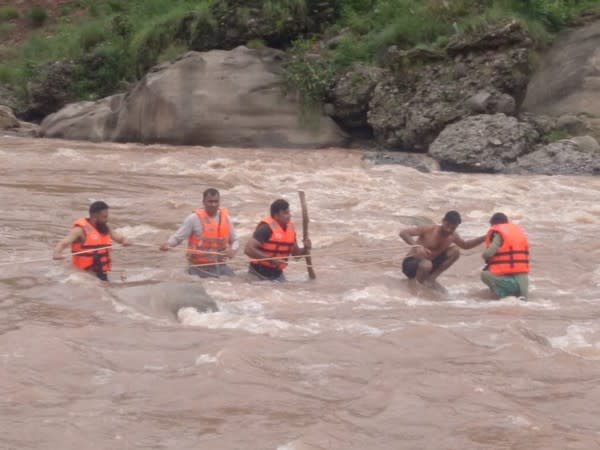 Visual from the rescue of a minor in a flash flood in Udhampur. (Photo/ANI)