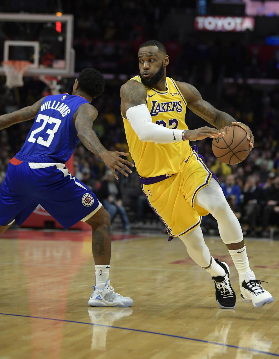Los Angeles Lakers forward LeBron James, right, drives by Los Angeles Clippers guard Lou Williams during the second half of an NBA basketball game Thursday, Jan. 31, 2019, in Los Angeles. The Lakers won 123-120. (AP Photo/Mark J. Terrill)