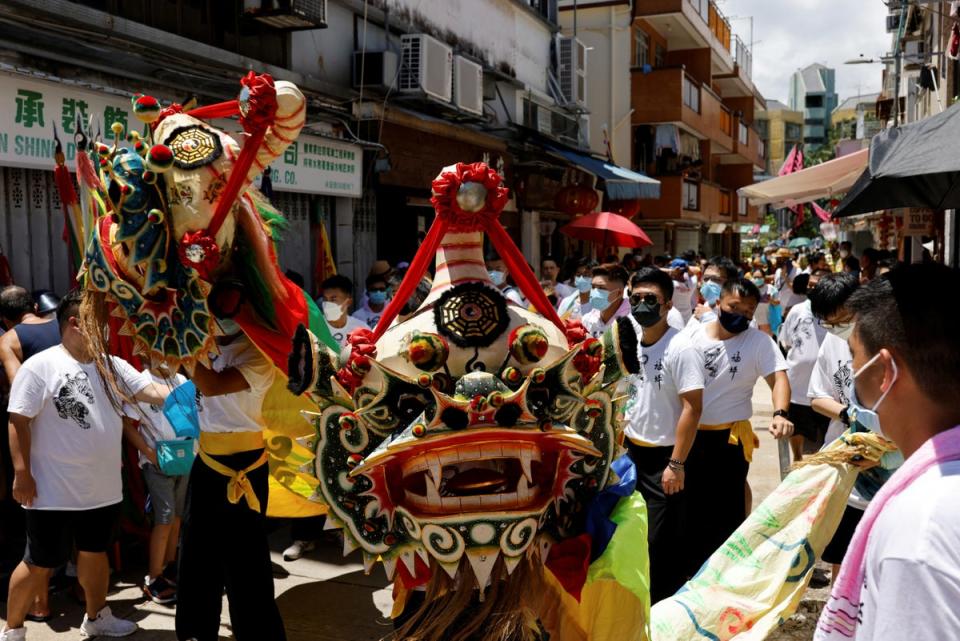 People join in the Tin Hau parade, the biggest festival on Peng Chau island which celebrates the birth of the sea goddess (Reuters)