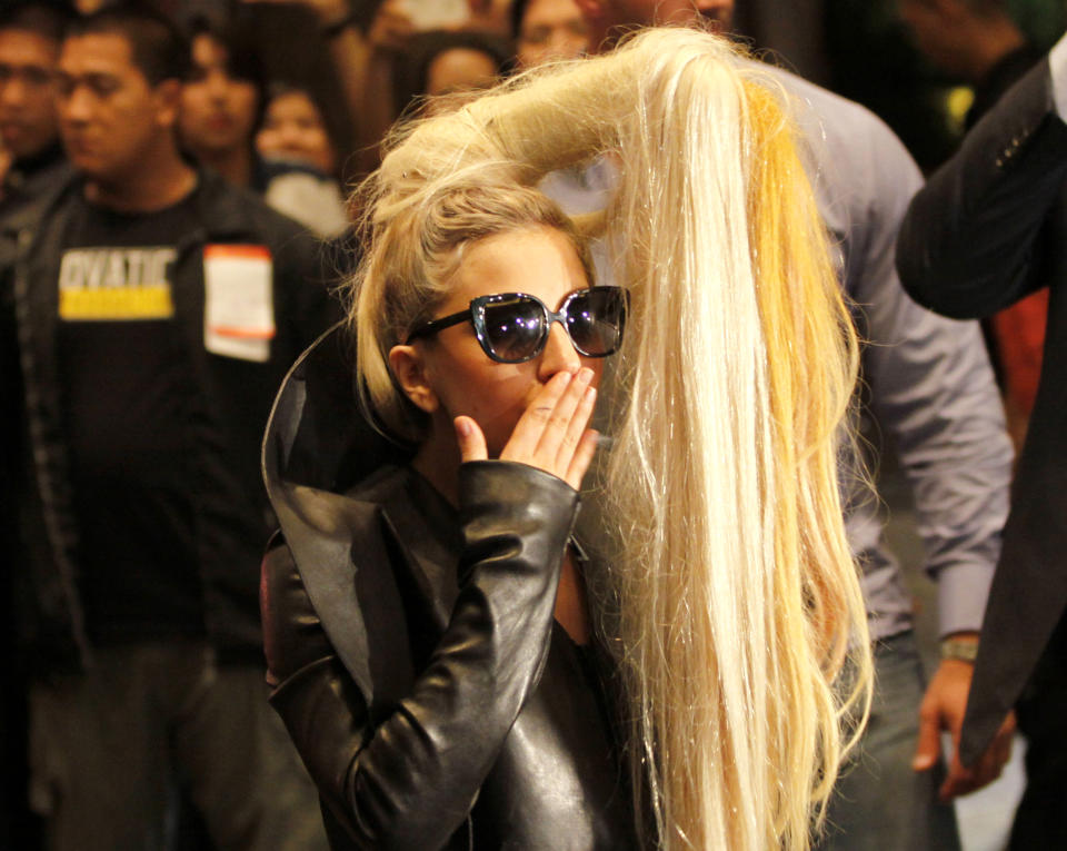 FILE - In this May 19, 2012 file photo, American pop singer Lady Gaga blows a kiss upon her arrival in a hotel in Manila's financial district of Makati, Philippines. Lady Gaga is as confused as anyone about whether she'll be allowed to perform in Indonesia following her performances in the Philippines. Police initially denied a permit for the "Born This Way Ball" but are now hinting the concert could ahead if the pop diva toned down the show. (AP Photo/Pat Roque, File)